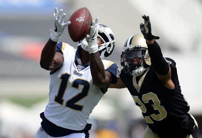 Rams receiver Brandin Cooks (12) catches a pass against Saints cornerback Marshon Lattimore (23). Mandatory Credit: Gary A. Vasquez-USA TODAY